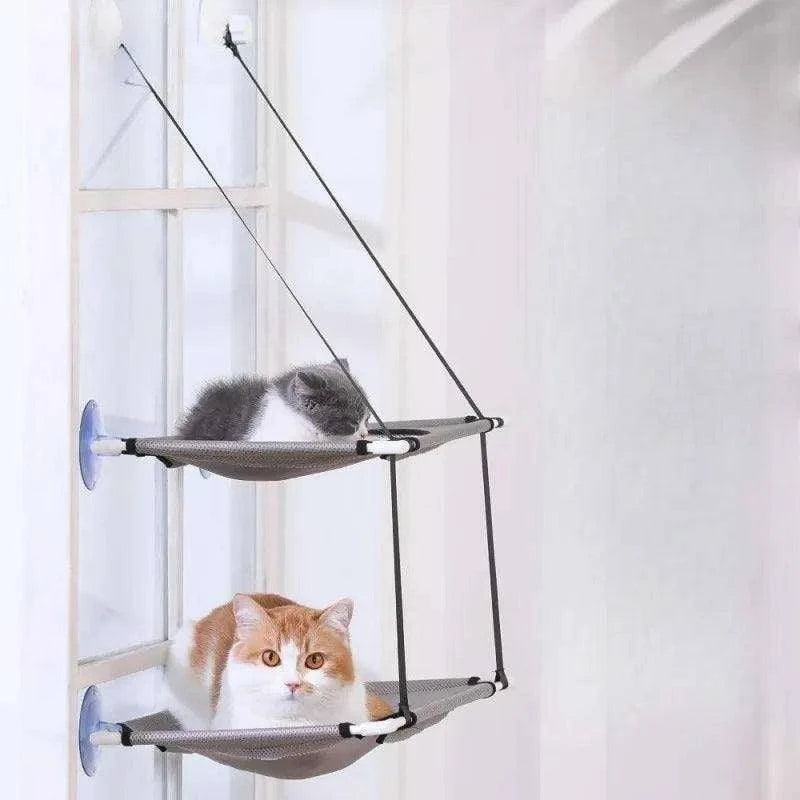 Double-Decker Cat Hammock BedDescription:
Give your cat the ultimate sunbathing spot with this double-decker hammock. Suction cup mounts securely to the window, offering a cozy space for loungiRegal Pet PalaceRegal Pet PalaceDouble-Decker Cat