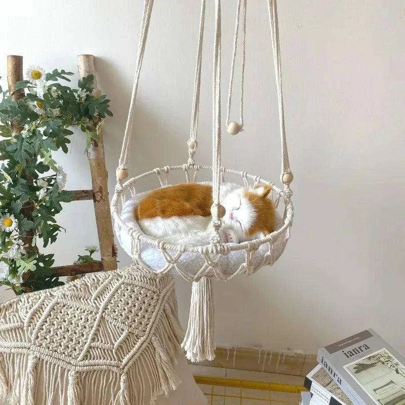 Cozy Cat Hammock SwingDescription:
Give your cat the ultimate lounging spot with this hand-woven hammock. Perfect for relaxation and play, this cozy swing will become your pet's favoriteRegal Pet PalaceRegal Pet PalaceCozy Cat Hammock